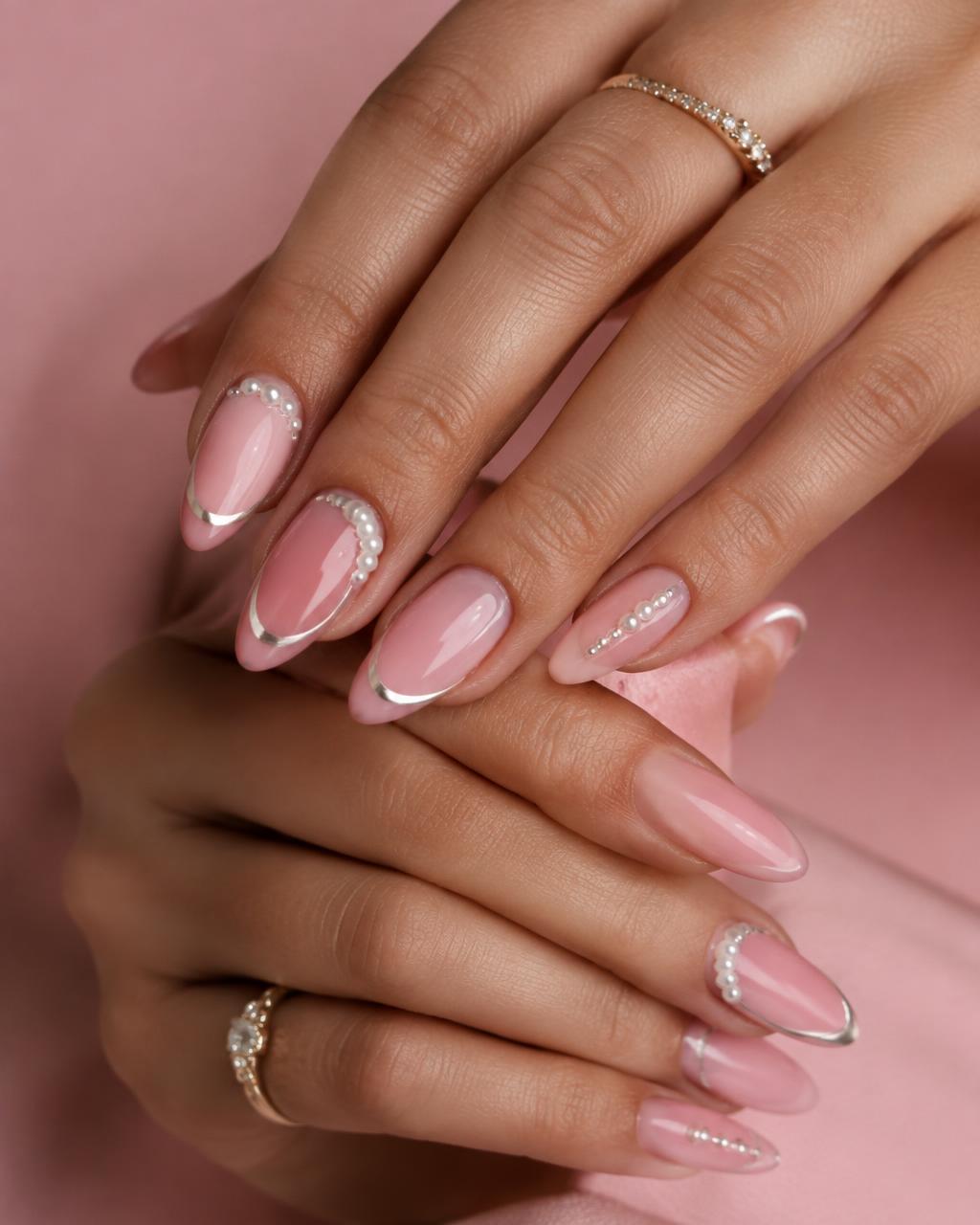 Soft pink gel nails with pearl accents